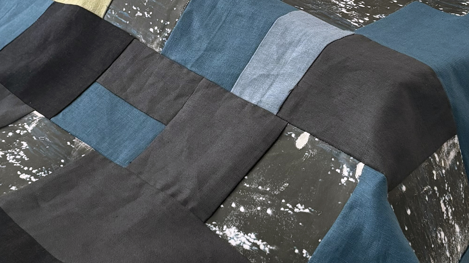 Özge Dîlan Arslan, Tracing What the Sea Alters, 2026. Detail of work in progress. Mixed media: patchworked linen, photographic gel transfers, screenprinted symbolic forms, and sewn elements. Dimensions variable.